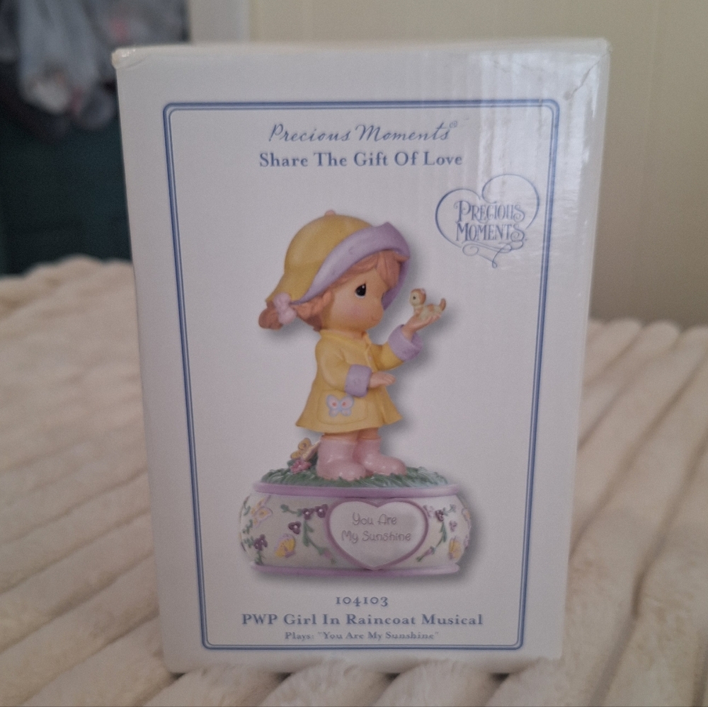 Precious Moments Musical Figurine “You Are My Sunshine” Girl in Raincoat 2010